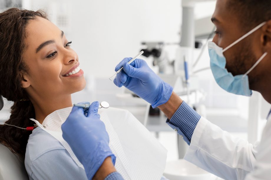 a woman smiles in dental chair